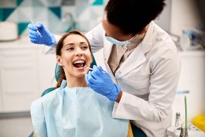 woman getting a dental exam at the dentist